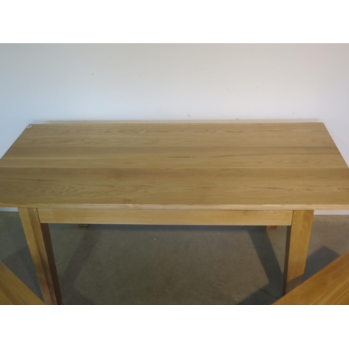 94 - A new oak dining table and two benches made by a local craftsman to a high standard, table H75cm x 1... 