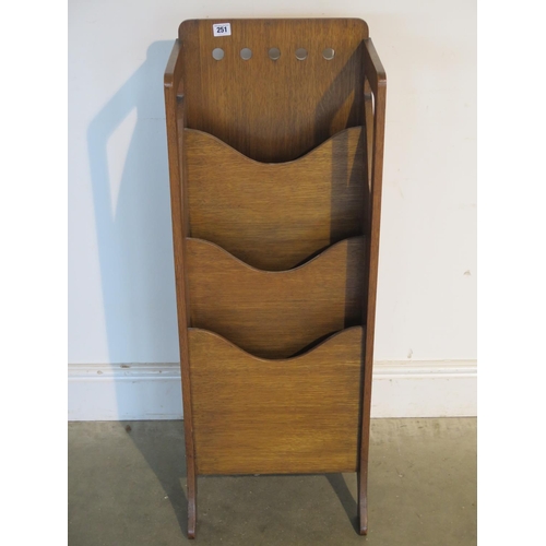 251 - An oak Art Deco magazine rack - 99cm tall, 36cm x 26cm - by Finnigans - damage to one leg