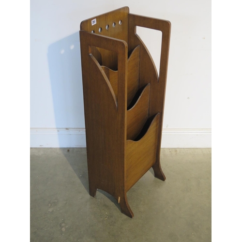 251 - An oak Art Deco magazine rack - 99cm tall, 36cm x 26cm - by Finnigans - damage to one leg