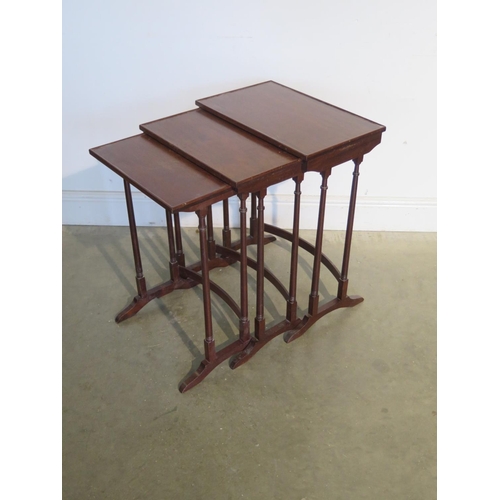 252 - A nest of three mahogany side tables - 63cm H x 49cm x 30cm