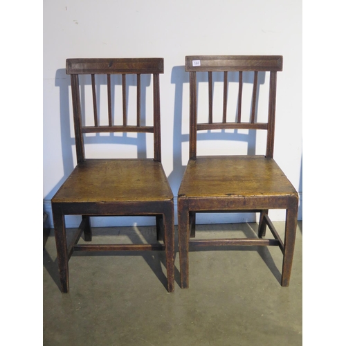 184 - A pair of Georgian solid seat side chairs