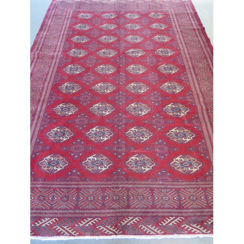 465 - A hand knotted woollen Baluchi rug 287cm x 200cm - good condition but some wear to middle