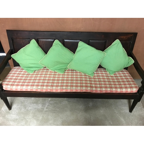 259 - An 18th Century oak hall bench with a panelled back on turned legs - W180cm