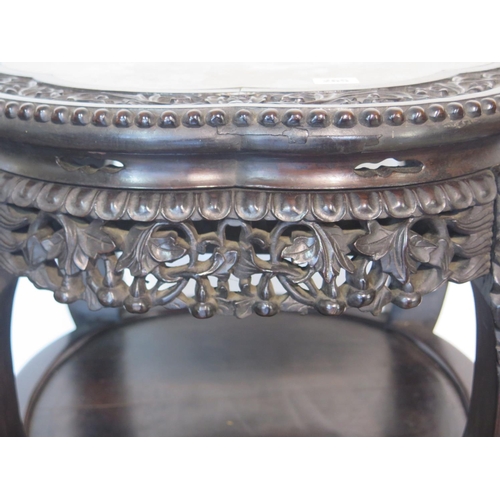 292 - A tall Oriental carved hardwood marble top jardiniere stand with under tier, with good colour and in... 