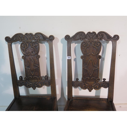 218 - A pair of 18th century carved oak chairs, with solid seats, 100cm tall