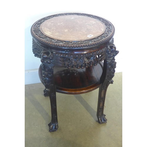 150 - A 19th century early 20th century Chinese carved hardwood jardiniere stand with a marble top, and an... 
