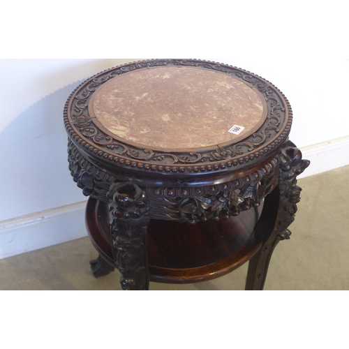 150 - A 19th century early 20th century Chinese carved hardwood jardiniere stand with a marble top, and an... 
