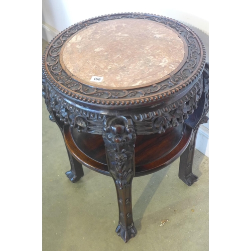 150 - A 19th century early 20th century Chinese carved hardwood jardiniere stand with a marble top, and an... 