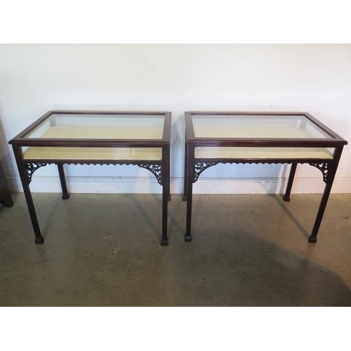 152 - A matched pair of mahogany bijouterie display tables with lift up tops, 71cm tall x 86cm wide x 54cm... 