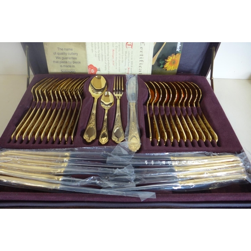 4 - A SBS Bestecke Solingen gold plated twelve setting canteen of cutlery in fitted case, in unused cond... 