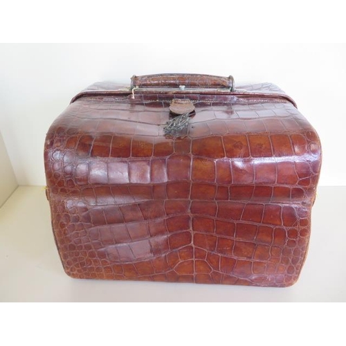 1240 - A late Victorian crocodile hide ladies vanity case, with silver and ivory fittings, 27cm tall x 37m ... 