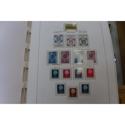 1369 - A comprehensive collection of Netherlands stamps from 1970-1990 housed in a Davo printed album - set... 