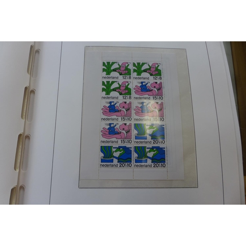 1369 - A comprehensive collection of Netherlands stamps from 1970-1990 housed in a Davo printed album - set... 