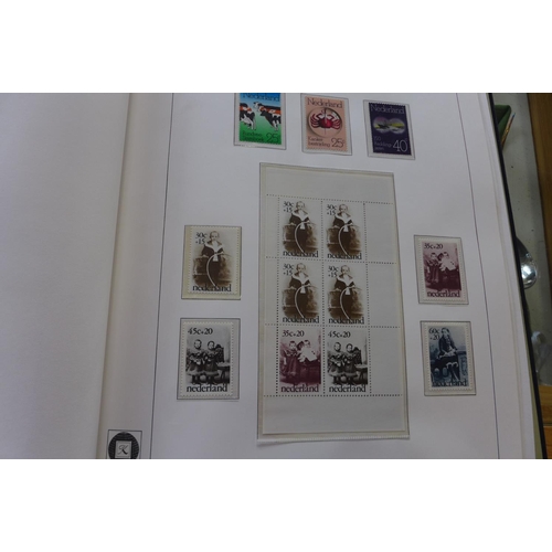 1369 - A comprehensive collection of Netherlands stamps from 1970-1990 housed in a Davo printed album - set... 