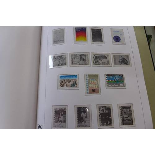 1369 - A comprehensive collection of Netherlands stamps from 1970-1990 housed in a Davo printed album - set... 