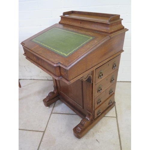 104 - A Victorian oak Davenport with four active drawers, and a maple interior, 84cm tall x 54cm x 54cm