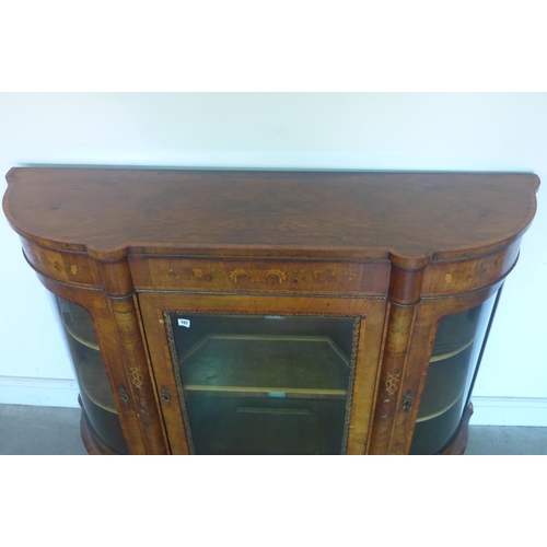 107 - A 19th century walnut marquetry inlaid three door side cabinet, with bowed glass side doors, 108cm t... 