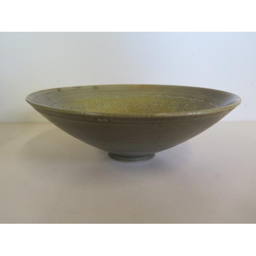 1228 - A Chinese olive-green Celadon bowl, 19cm diameter, glaze firing fault otherwise good