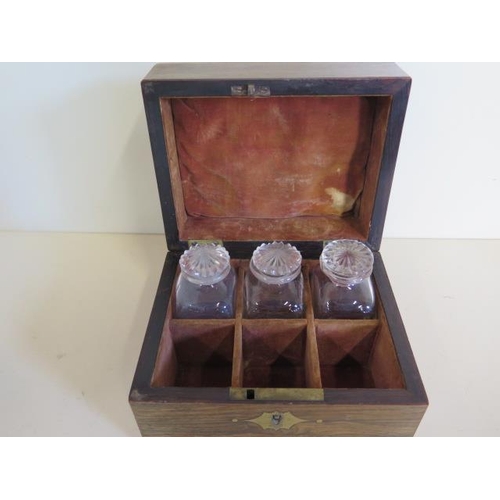 1232 - A 19th century mahogany travel box, with three bottles in a six section interior, missing three bott... 