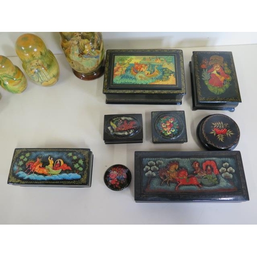 1269 - A good collection of seven hand painted Russian papier mache boxes, a brooch and a well painted Russ... 