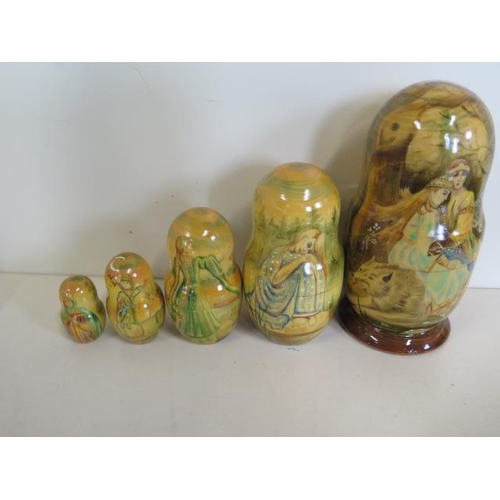 1269 - A good collection of seven hand painted Russian papier mache boxes, a brooch and a well painted Russ... 