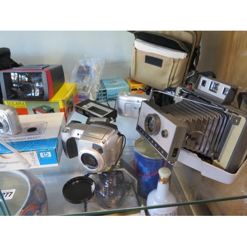 1277 - A collection of vintage and later camera cine and camcorder equipment including a Polaroid 320 land ... 