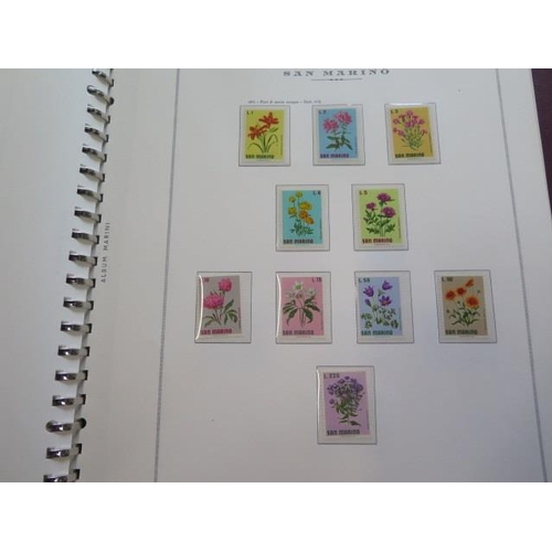 1360 - A collection of primarily mint hinged San Marino stamps, including in blocks of four, in a stock boo... 