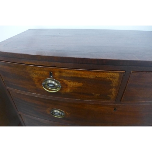 143 - A Georgian mahogany and cross banded ebony strung bow fronted chest of two over three drawers, in po... 