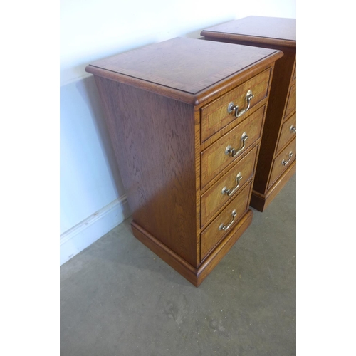 19 - A pair of burr oak four drawer bedside chests, made by a local craftsman to a high standard incorpor... 