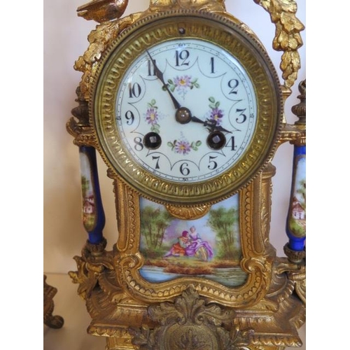 206 - A 19th century spelter clock garniture with decorated porcelain, the 8 day movement stamped 6405 and... 