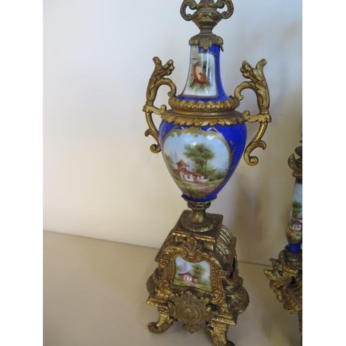 206 - A 19th century spelter clock garniture with decorated porcelain, the 8 day movement stamped 6405 and... 