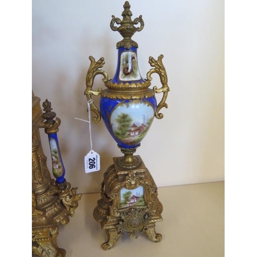 206 - A 19th century spelter clock garniture with decorated porcelain, the 8 day movement stamped 6405 and... 