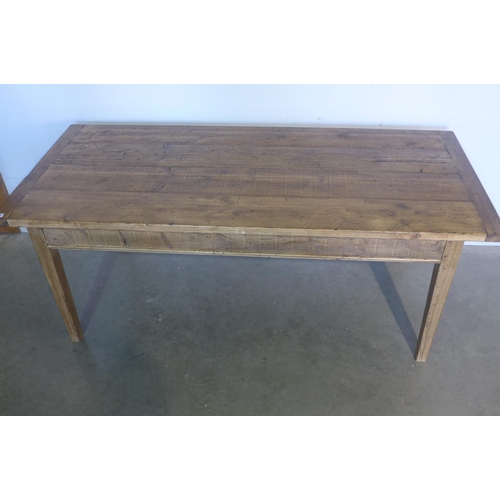 21 - A rustic pine kitchen table - 75cm tall x 190cm x 84cm