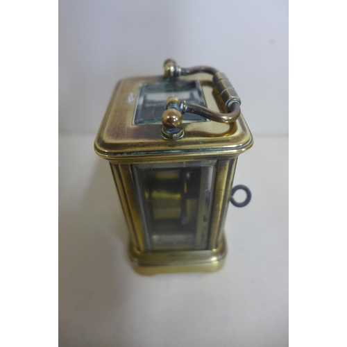 212 - An 8 day miniature carriage clock, 8cm tall, running