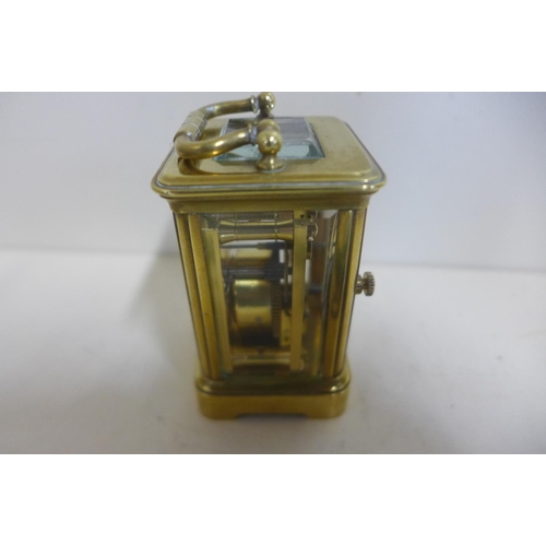 213 - An 8 day miniature carriage clock, 8cm tall