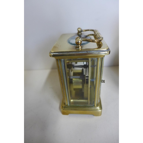 220 - An 8 day carriage clock with case - 12cm tall, with key and running but stops