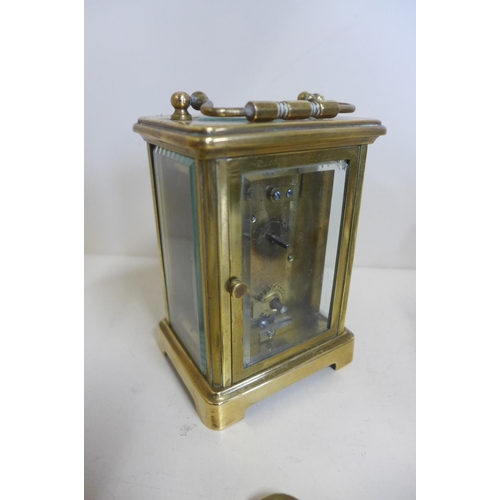 222 - An 8 day carriage clock, 12cm tall, running with key, chip to one glass