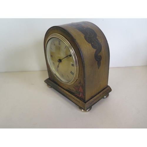 223 - A chinoiserie decorated mantle clock, 15cm tall, in running order