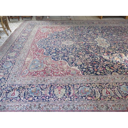 301 - An antique Persian carpet - removed from a Cambridge College, possibly early 20th century from North... 