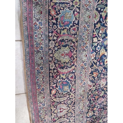 301 - An antique Persian carpet - removed from a Cambridge College, possibly early 20th century from North... 