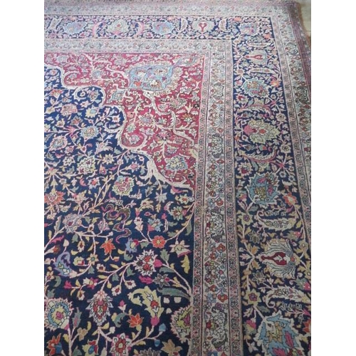 301 - An antique Persian carpet - removed from a Cambridge College, possibly early 20th century from North... 