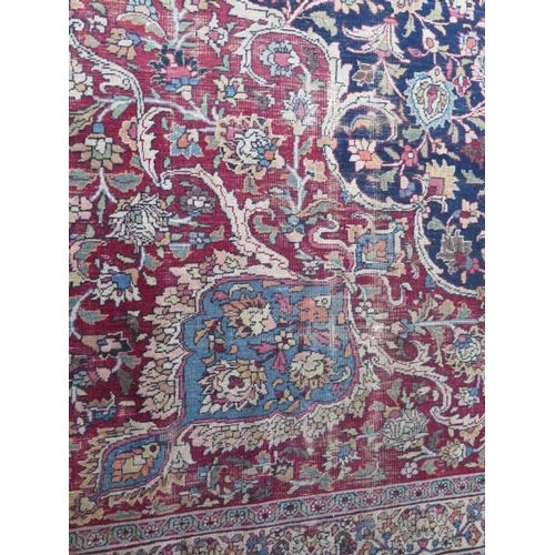 301 - An antique Persian carpet - removed from a Cambridge College, possibly early 20th century from North... 