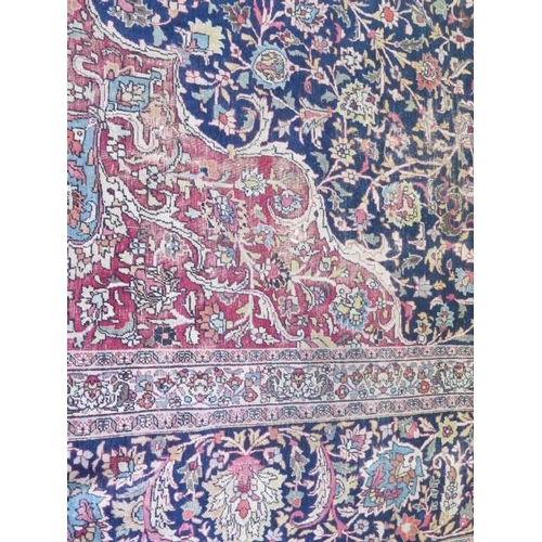 301 - An antique Persian carpet - removed from a Cambridge College, possibly early 20th century from North... 