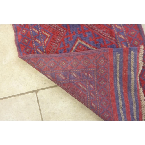 307 - A hand knotted woollen Meshwani runner, 250cm x 62cm