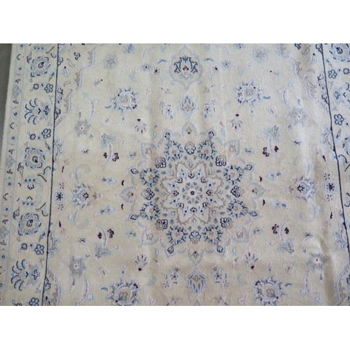 318 - A hand knotted woollen Fine Nain rug, 204cm x 135cm