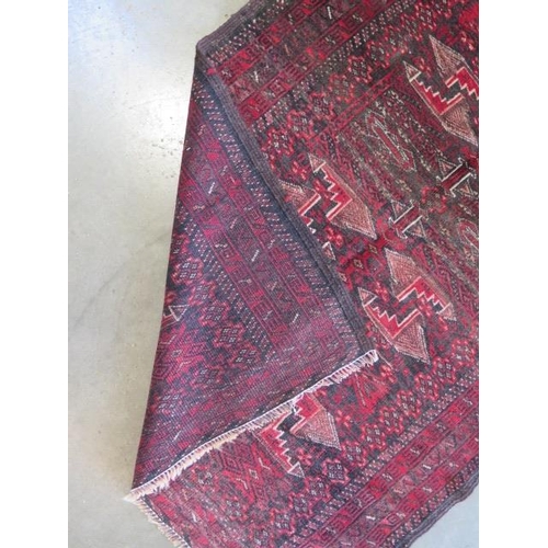 327 - A hand knotted woollen Persian rug, 165cm x 88cm