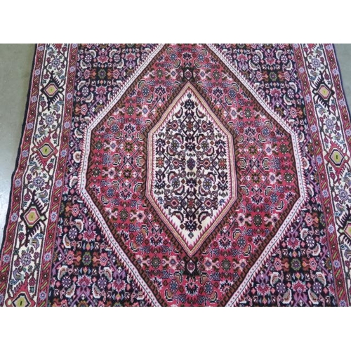 329 - A hand knotted woollen Zanjan rug, 172cm x 120cm