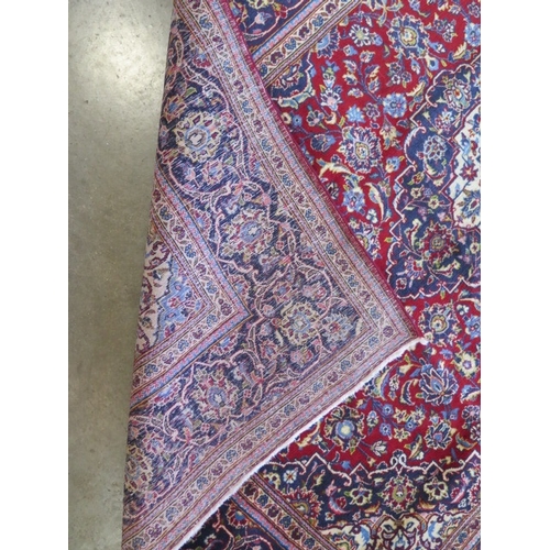 324 - A hand knotted woollen Persian rug, 220cm x 197cm