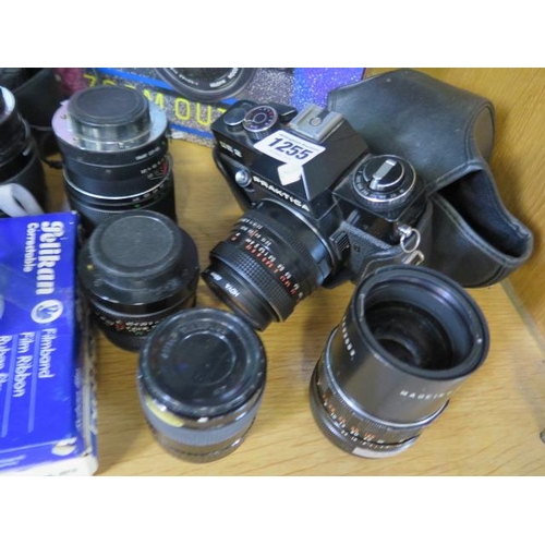 1255 - A collection of cameras, equipment and lenses including a Minolta 5000, Praktica EE2 and a bellows c... 