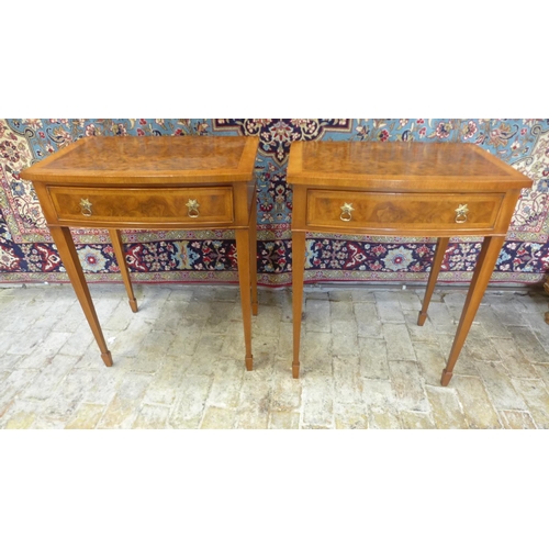 8 - A pair of walnut bow fronted lamp tables, each with a frieze drawer on square tapering legs, 77cm ta... 